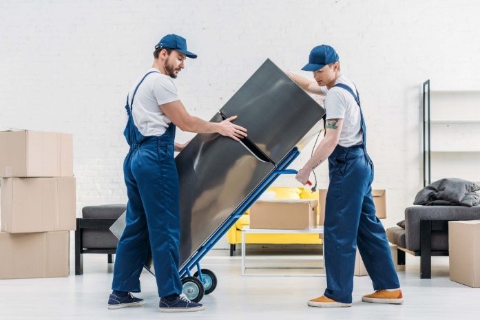 Staff holding refrigerator